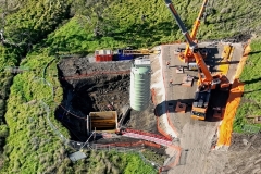 Water tank installation - lowering into position in the prepared hole